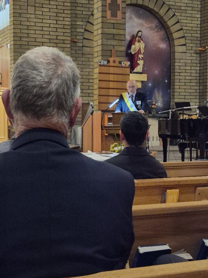 A new Brother Knight receiving his pin