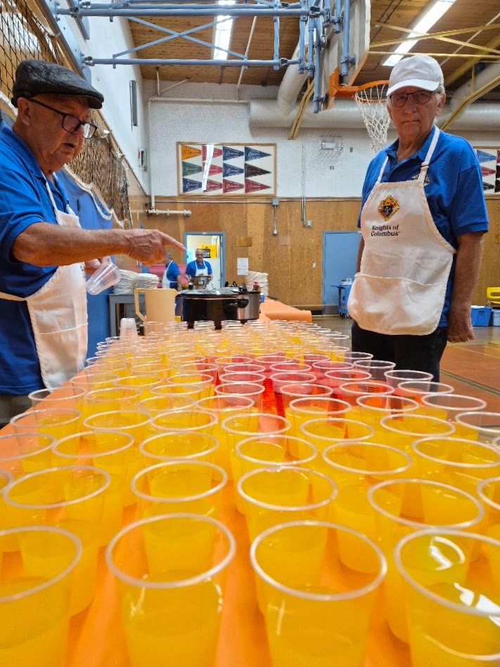 Pouring juice for students at Rock City School